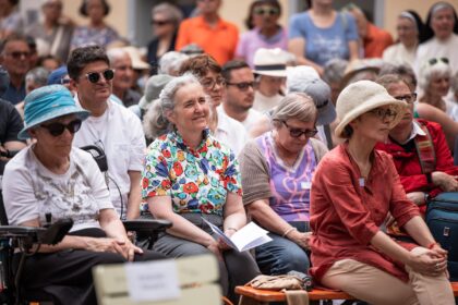 a group of people sitting in chairs